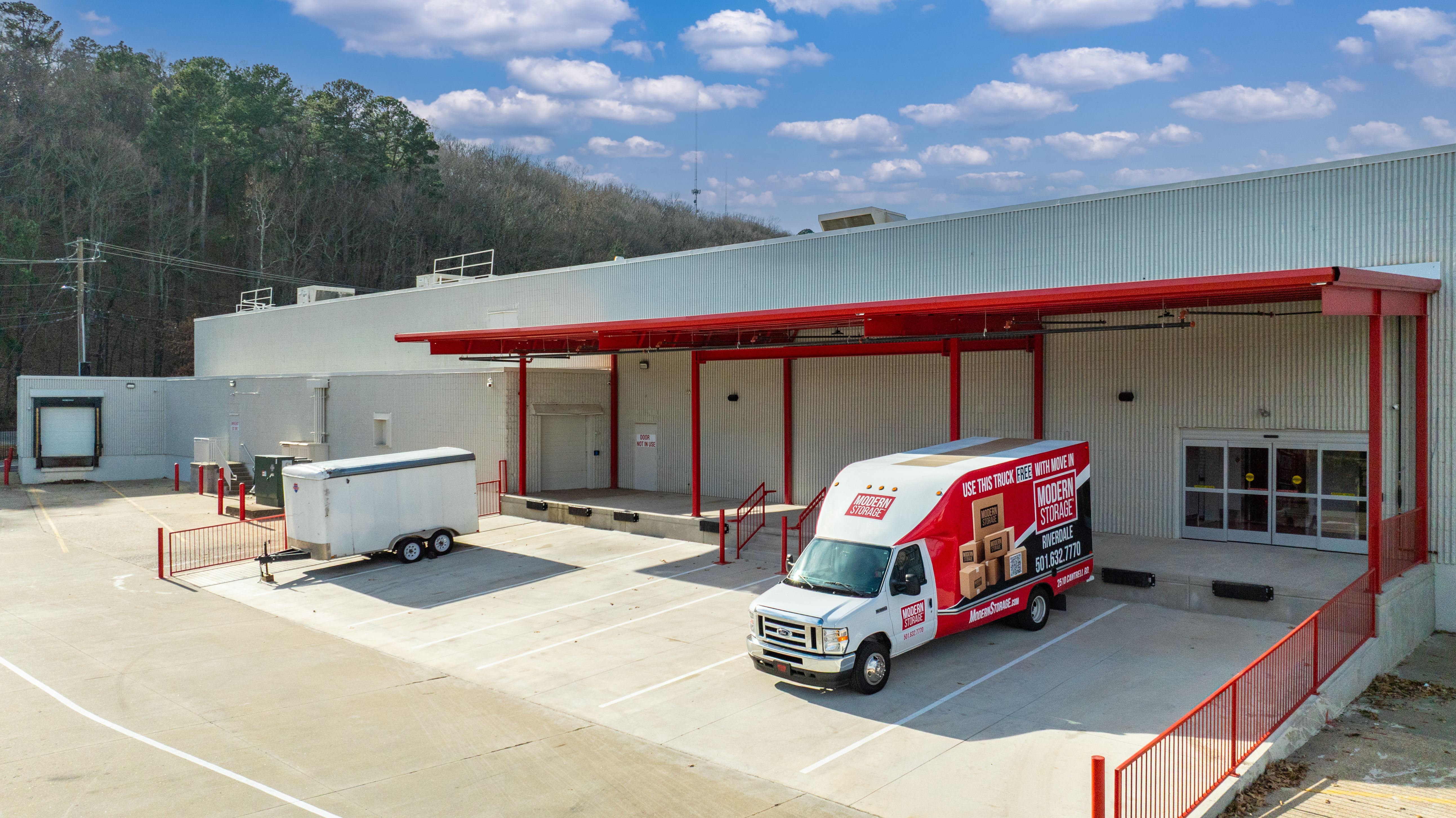 Covered loading dock at Modern Storage® Riverdale with drive-up access and moving truck